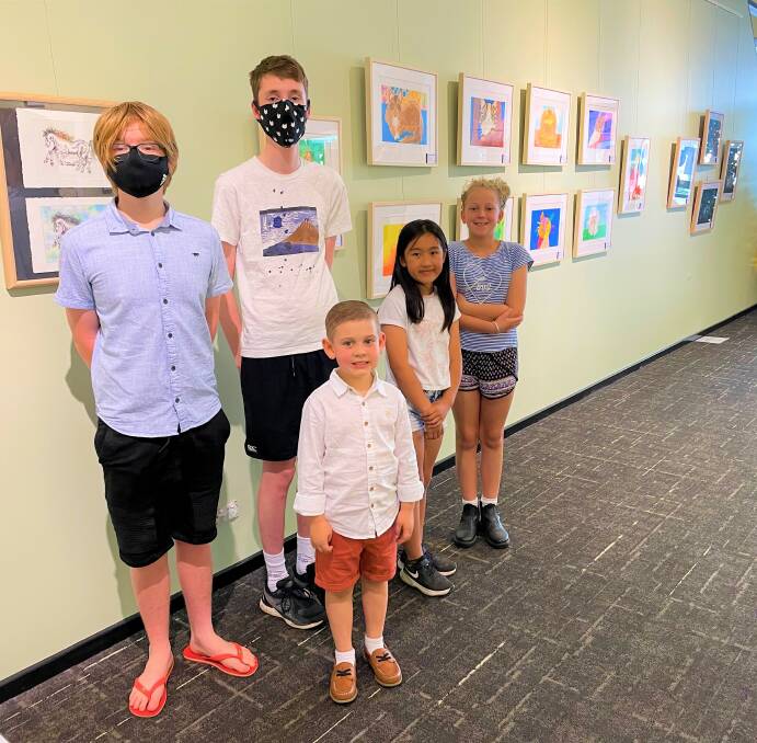 EXHIBITION: Casscar Creative Arts Studio students Isaac Maloney, Ethan Butcher, Preston Edwards, Athena Pattamaprapanon and Sylvie Romeyn with some of the works on display at Cessnock Library throughout December and January.