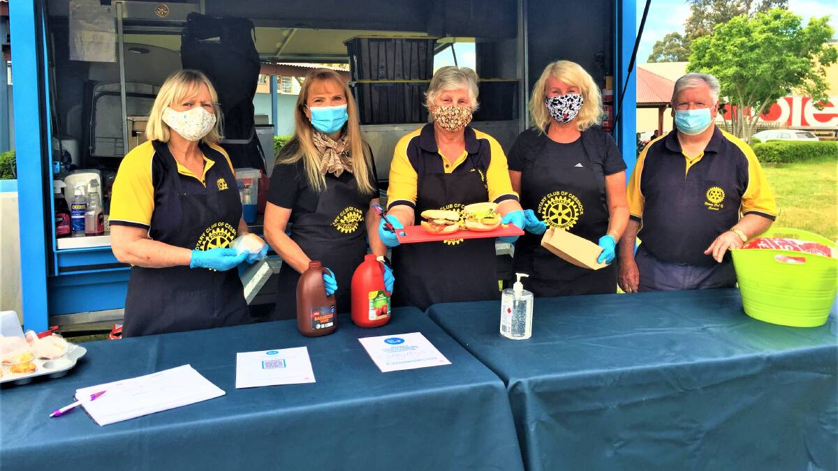 LUNCH IS SERVED: Rotary Club of Cessnock volunteers Vicki Steep, Penny McNaughton, Harma Hill, Sharon Waite and Greg Bevan preparing lunch at the TAFE grounds on Tuesday. Picture: Krystal Sellars
