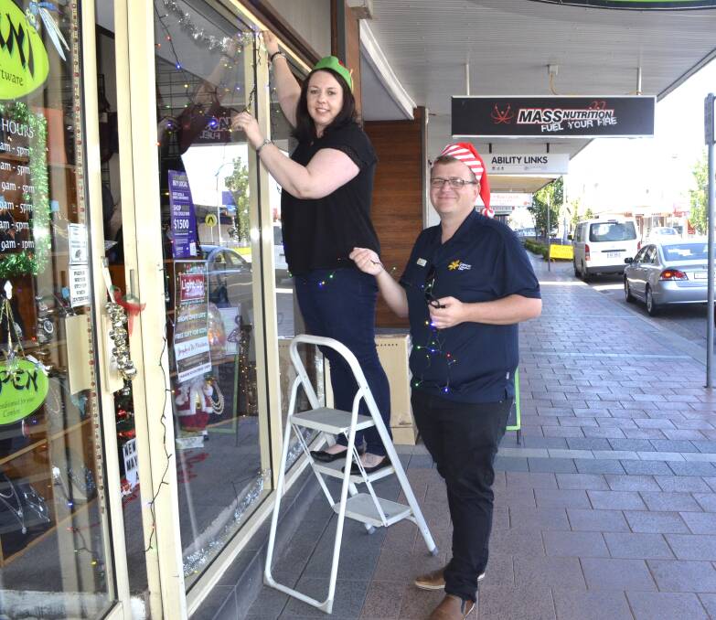 SPIRIT: Jdlani Jewellery and Giftware owner Michelle James and Cessnock Chamber of Commerce president Clint Ekert preparing for the Light-Up event.