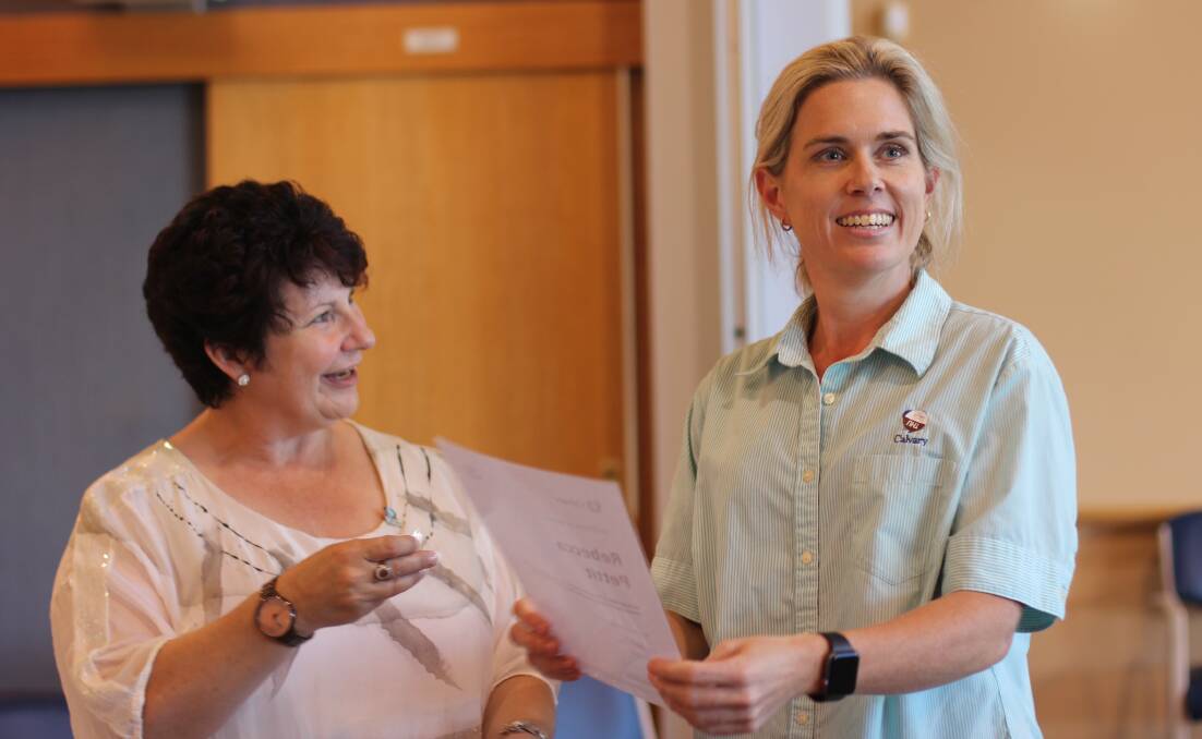 MILESTONE: Calvary Cessnock Retirement Community manager Dyanne Johnston presents care worker Rebecca Pettit with her 15-year service certificate.
