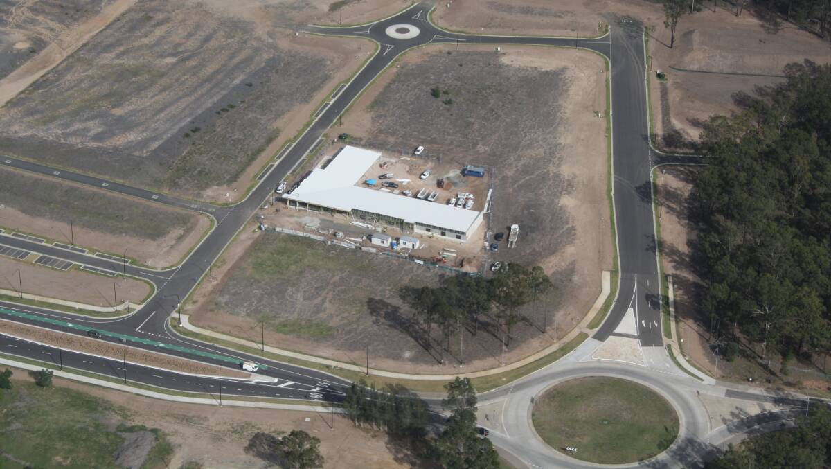 ON TRACK: An aerial shot showing the Huntlee Early Learning Centre under construction and the completed upgrade to Wine Country Drive. Picture: supplied
