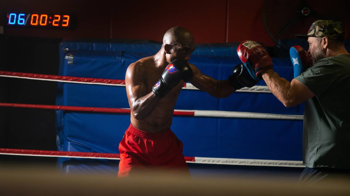 HARD WORK: Sakio Bika hits the pads during a session with Rob Atherton at the Lake Macquarie PCYC ahead of his fight against Adam Stowe. Picture: Marina Neil