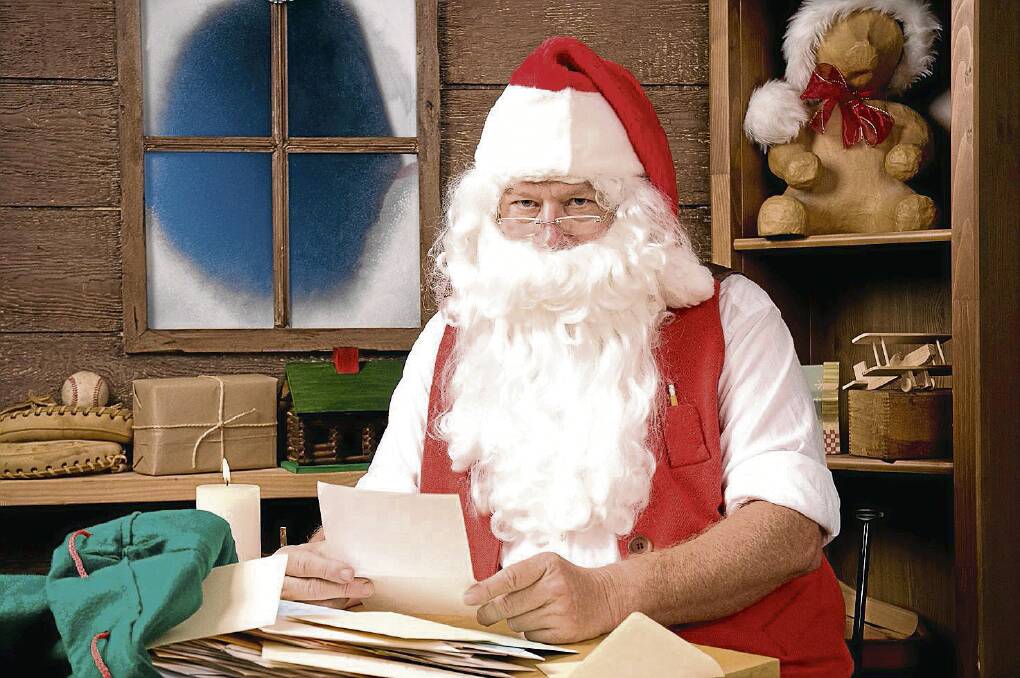 BUSY: Santa Claus is making his way through the letters of children from all over the world, including the good boys and girls of Cessnock City.