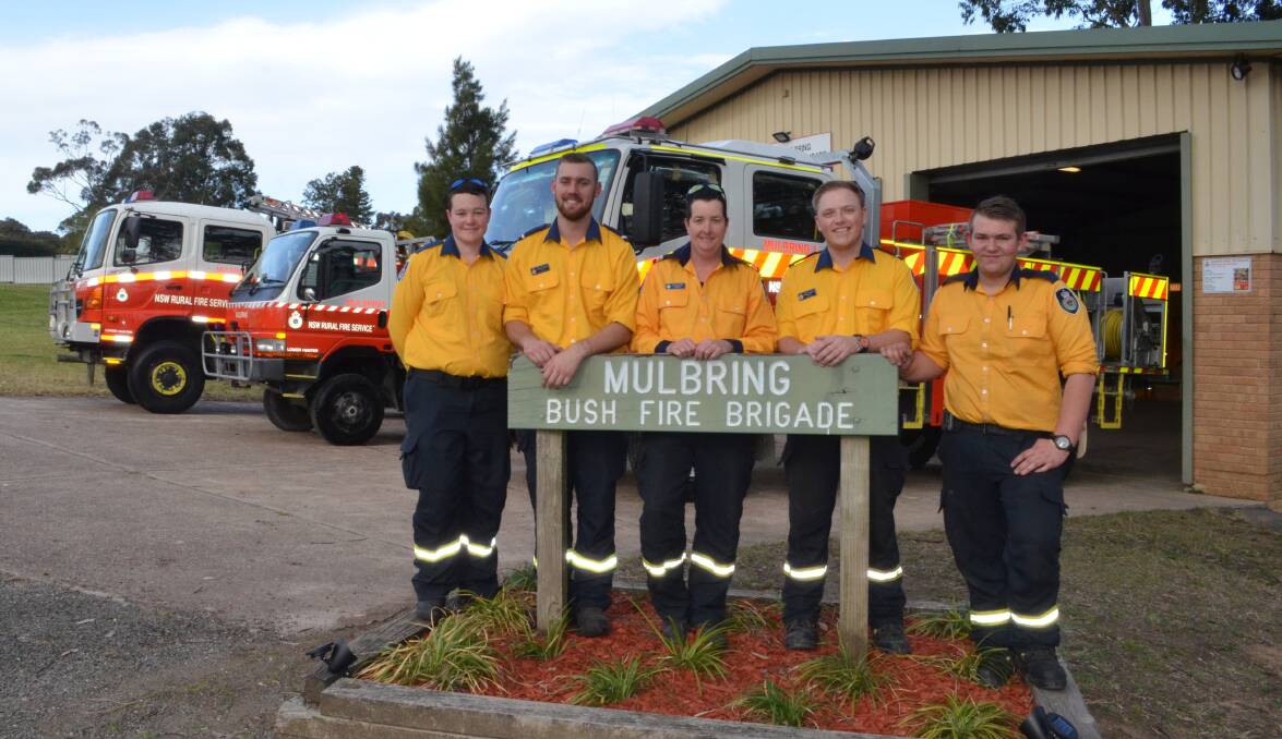 HERE TO HELP: Mulbring Rural Fire Brigade volunteers Deanne Daniew, deputy captain Campbell Anlezark, senior deputy captain Rebecca Callan, deputy captain Blake Kingdom and Matt Field. The station will hold its Get Ready Weekend event on Saturday.