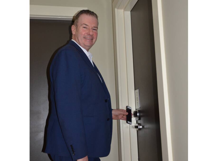NEW TECHNOLOGY: Crowne Plaza Hunter Valley general manager Lachlan Walker demonstrates the hotel's keyless entry via smartphone. Picture: Krystal Sellars