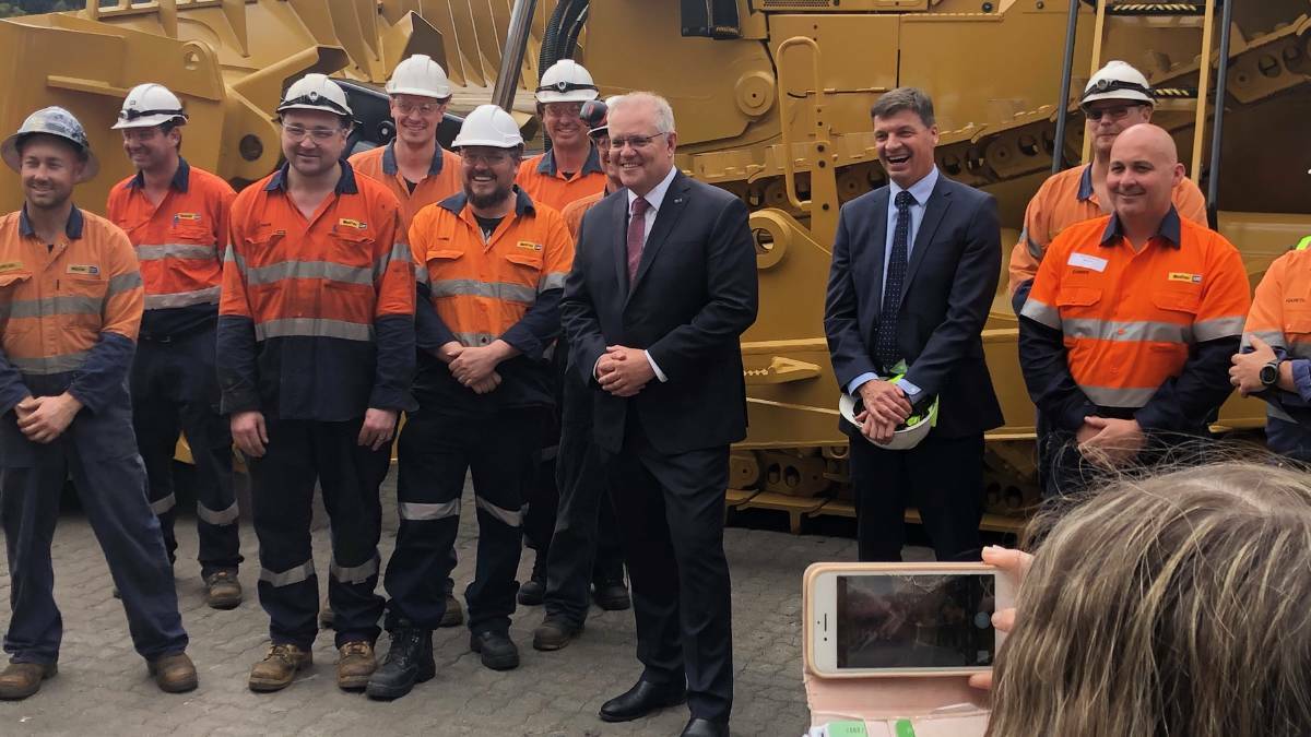 VISIT: Prime Minister Scott Morrison and energy minister Angus Taylor with workers at Tomago on Tuesday. Picture: Simone de Peak