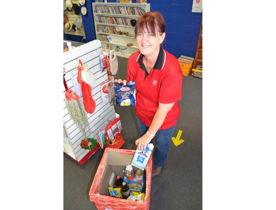 IN HIGH DEMAND: Major Wendy-Sue Swann from Cessnock Corps with some of the items being collected for this year's Christmas Appeal. Picture: Krystal Sellars