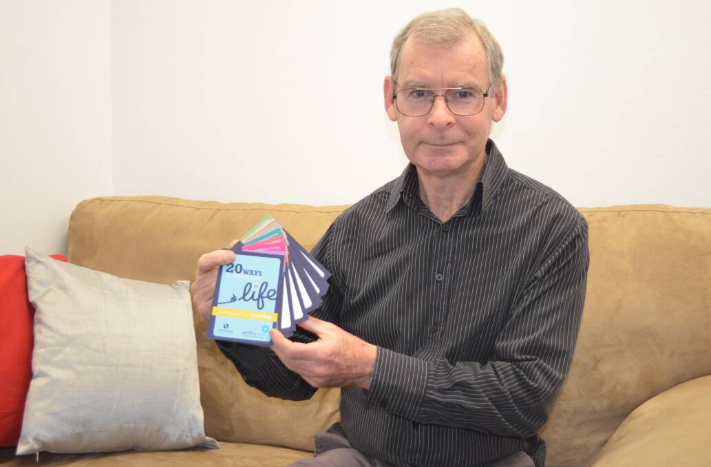 TECHNIQUES: Samaritans Gambling Help counsellor Graeme Penney with the self-help flip-book that is available at the Cessnock service.