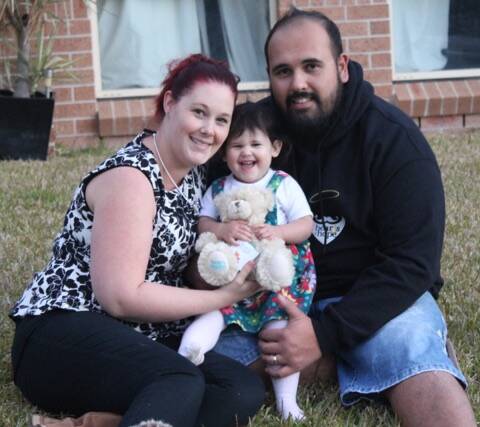 TREASURED: Cat and Russell Relf and their daughter Cadence, 21 months, with their Bear of Hope they received in memory of their daughter Savannah.