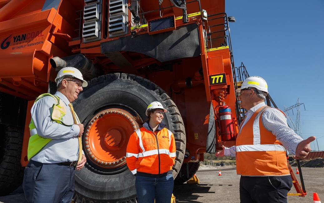Deputy Premier and Resources Minister John Barilaro, right, with Yancoal mine worker Leah Miller and Upper Hunter MP Michael Johnsen at Mount Thorley/Warkworth open cut mine on Wednesday.