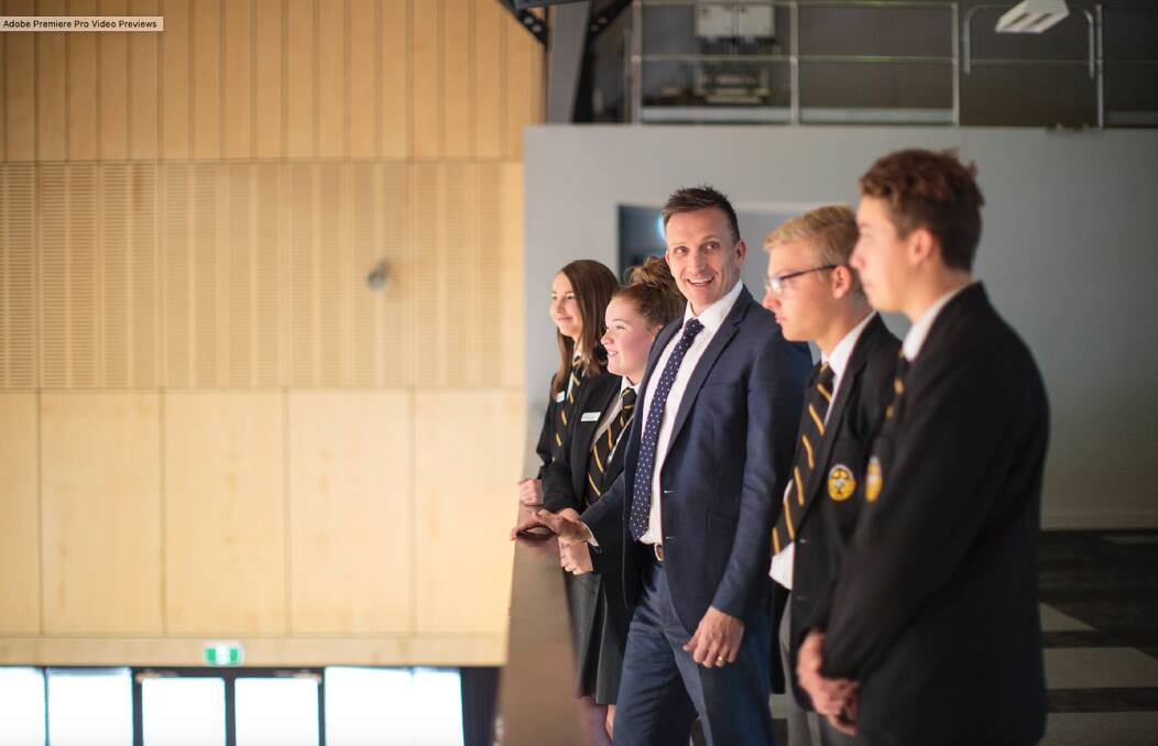 COMBATING ISSUES: St Philip's Christian College Cessnock principal Darren Cox inspects the new facilities with students at last Friday's official opening.