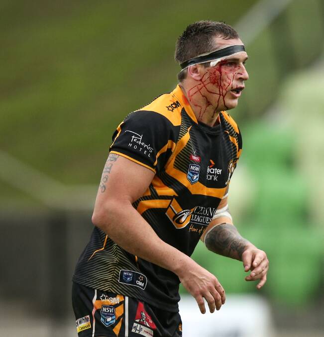 BLACK AND GOLD: Retiring Cessnock Goannas forward Brendan Hlad plays on despite blood on his face earlier this Newcastle Rugby League season. Picture: Marina Neil