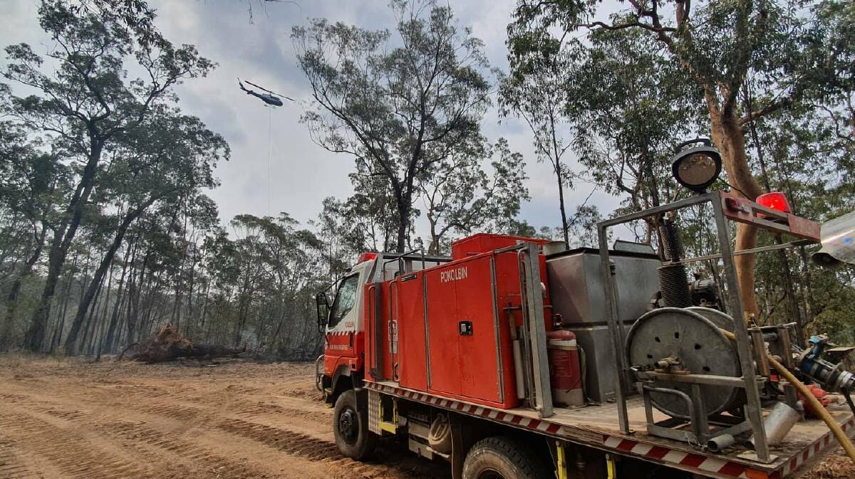 SCENE: Firefighting aircraft assists the Pokolbin Rural Fire Brigade at the Owendale fire near Broke last summer. Picture: Lewis Drayton