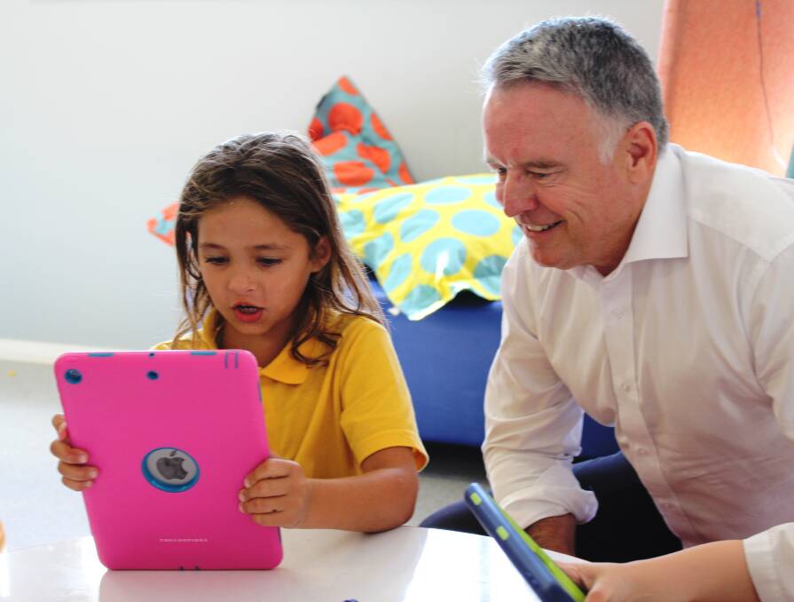 LEARNING: Hunter MP Joel Fitzgibbon with a Cessnock Multipurpose Children’s Centre student. Pictures: Supplied