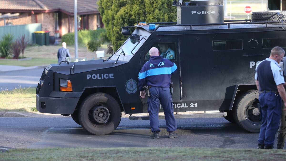 An armoured vehicle at the scene in McBlane Street. Picture: Marina Neil