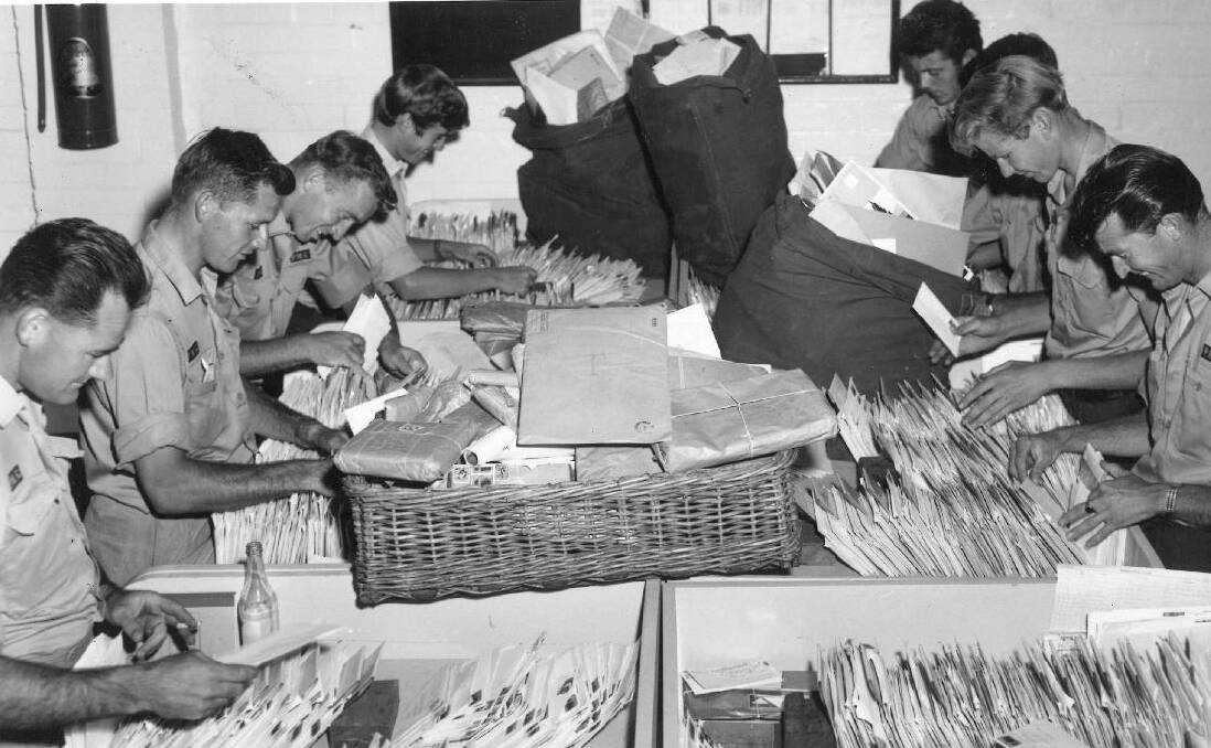 WORKING HARD: Cessnock postmen in the mail sorting room at Cessnock Post Office. Undated. Picture: Supplied
