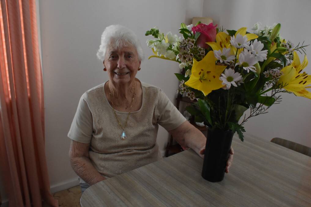 CELEBRATION: Mary Buchanan with some flowers she received for her 100th birthday.