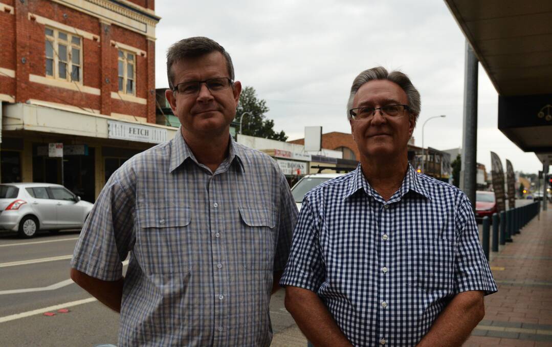 HELP: Steve Wood from Cessnock Congregational Church and centre manager for the Cessnock debt and budget program Wayne Cooke of New Vine Vineyards Church.