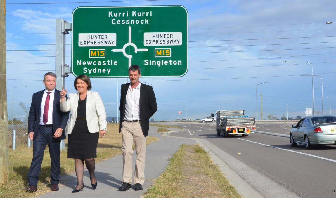 FUNDING: Hunter MP Joel Fitzgibbon, Labor candidate for Paterson Meryl Swanson and Labor candidate for Cessnock City Council Darrin Gray at the Heddon Greta exit of the Hunter Expressway.