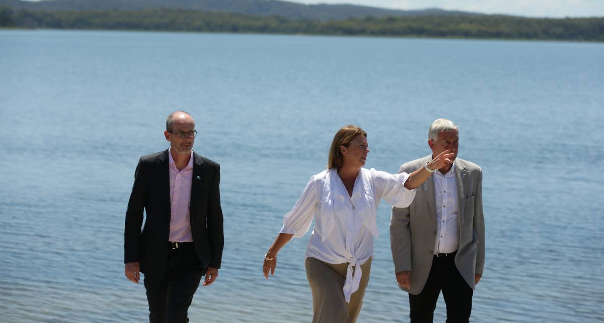 Minister for Water Melinda Pavey (centre) with Darren Cleary and Graham Wood from Hunter Water announcing that water restrictions would be wound back. Picture: Jonathan Carroll 