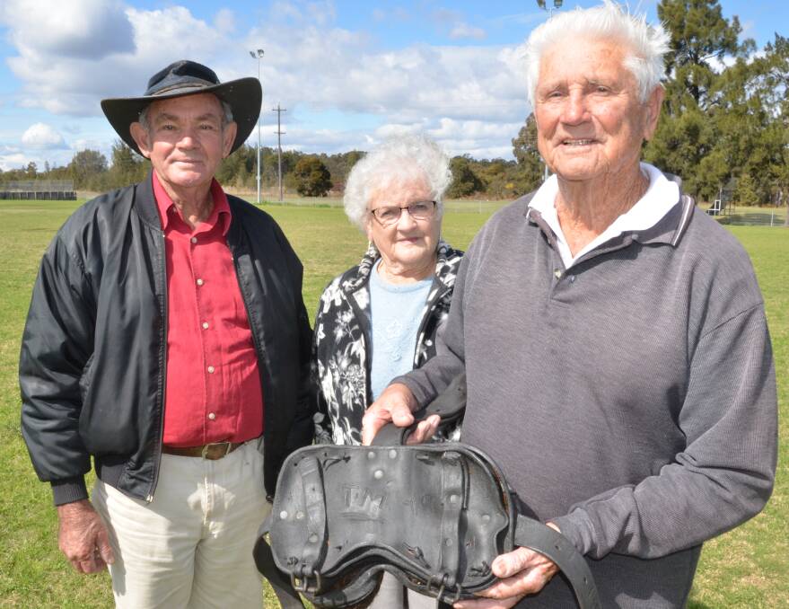 HISTORICAL: The pit horse statue committee members Col Andrews, Mary Holdom and Tom Outram with the horse harness found at Richmond Vale Railway Museum.