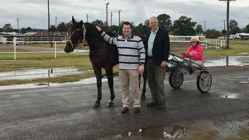 Cessnock councillor Jay Suvaal and mayor Bob Pynsent with harness racing driver Grace Harmey at Cessnock Showground.