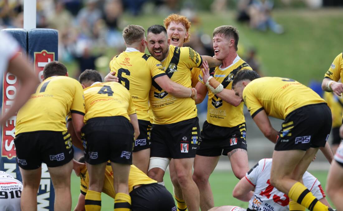 CHAMPIONS: Cessnock players on the way to last season's grand final win over Souths.