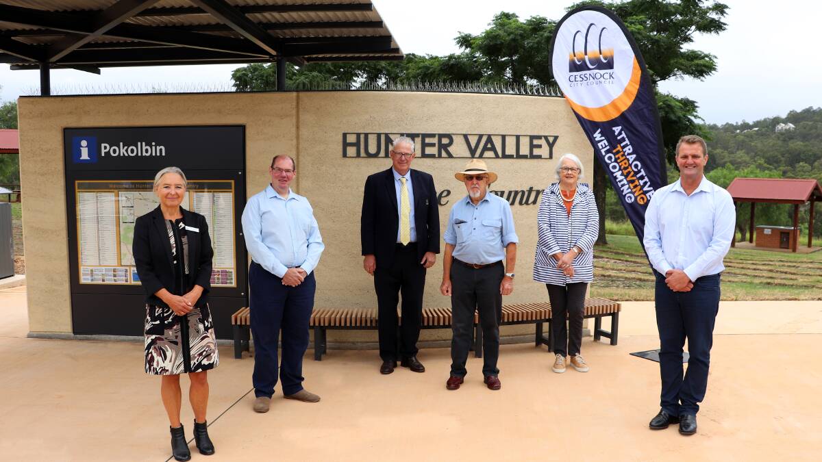 SIGN OF THE TIMES: Councillor Mark Lyons, Cessnock Mayor Bob Pynsent, Jay and Julia Tulloch of Tulloch Wines, and Clayton Barr MP at one of the new information bays.