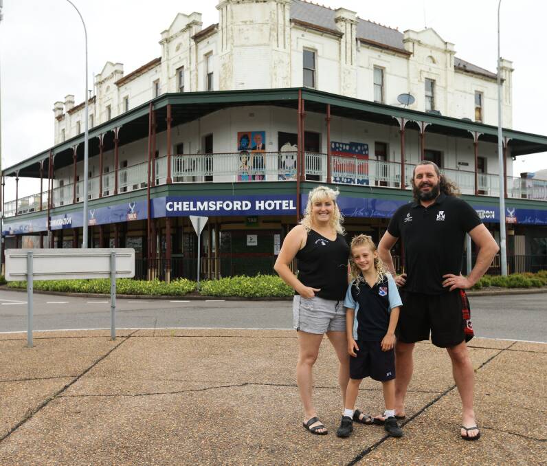 BRING IT ON: Laura Johnson with son Max and Mulletfest hopeful Josh Hogg who wowed the crowd last year with the bright yellow silk shorts he bought for the big day. Picture: Jonathan Carroll