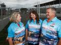 EXCITED: Suzy Moffitt, centre, with Linda and Allan Locking at the Newcastle Supercars track near Nobbys. Picture: Max Mason-Hubers