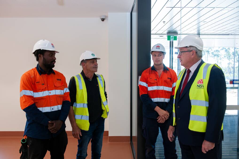 New space: Health Minister Brad Hazzard chats with some of the local people who worked on the Maitland Hospital project. Picture: Supplied