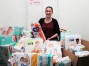 Support: Electorate officer Kayla Checkley with items donated to Sonia Hornery's office in Wallsend for the Nappy Collective. Picture: Peter Lorimer