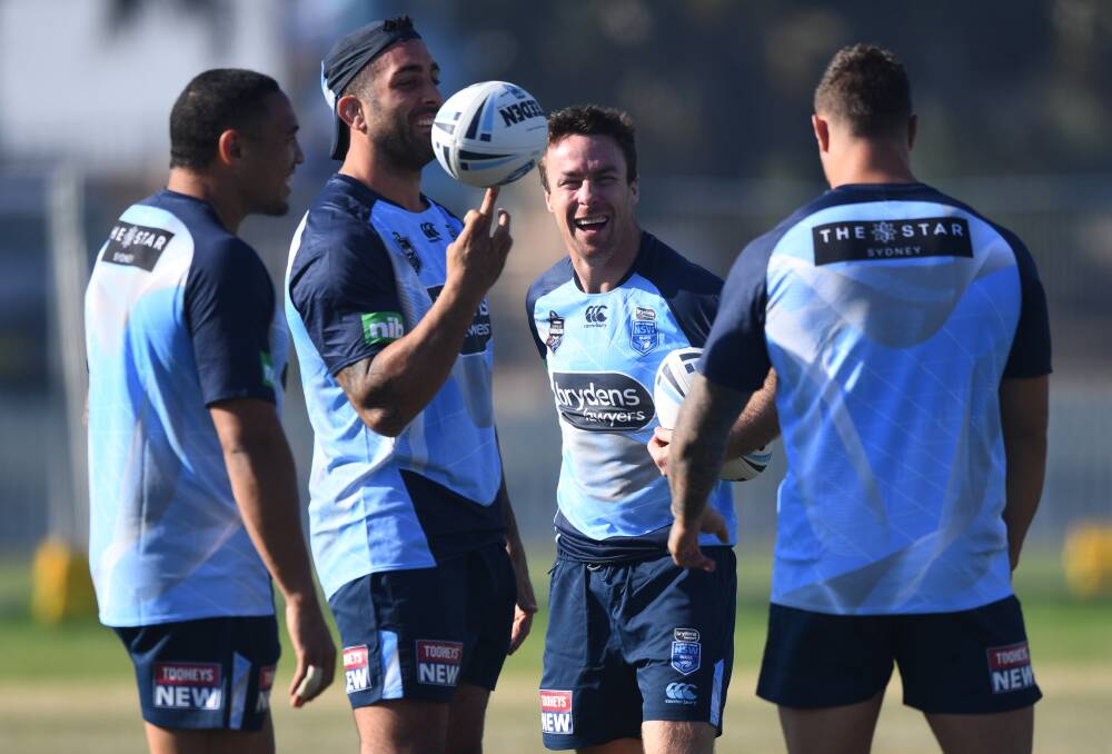 In camp: James Maloney (second right) with teammates oin Coogee yesterday.