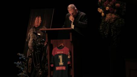 EMOTIONAL: Knights premiership-winning coach Michael Hagan delivering a tribute at Jack Newton's funeral service on Wednesday. Picture: Simone De Peak