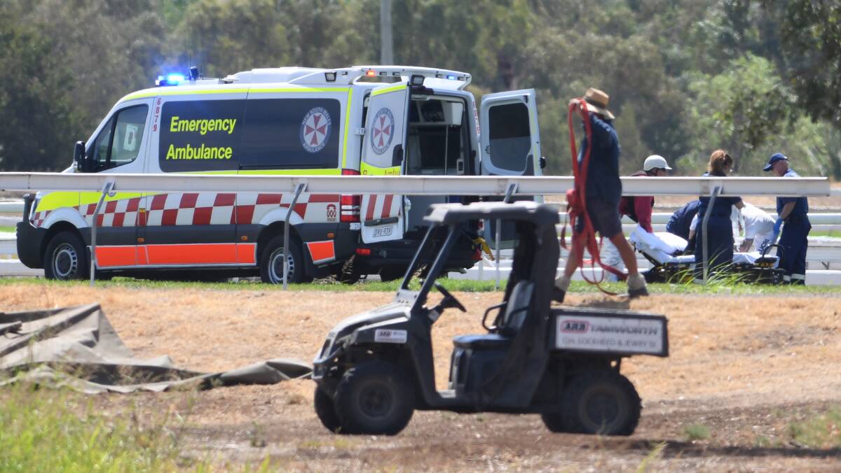 RACE FALL: Five jockeys were taken to hospital after a fall in Race 2 at the Country Championships on Sunday. Photo: Gareth Gardner