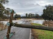DESTRUCTION: Powerlines were ripped down and roads washed away near Broke as councils start to assess damage. Picture: Supplied