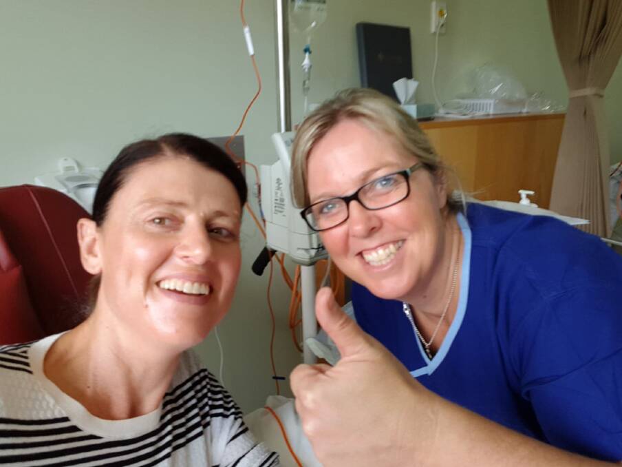 SUPPORT (BOTTOM): Claire Farrer was comforted during her first chemotherapy session in April 2018 thanks to nurse Lisa Kellett. 