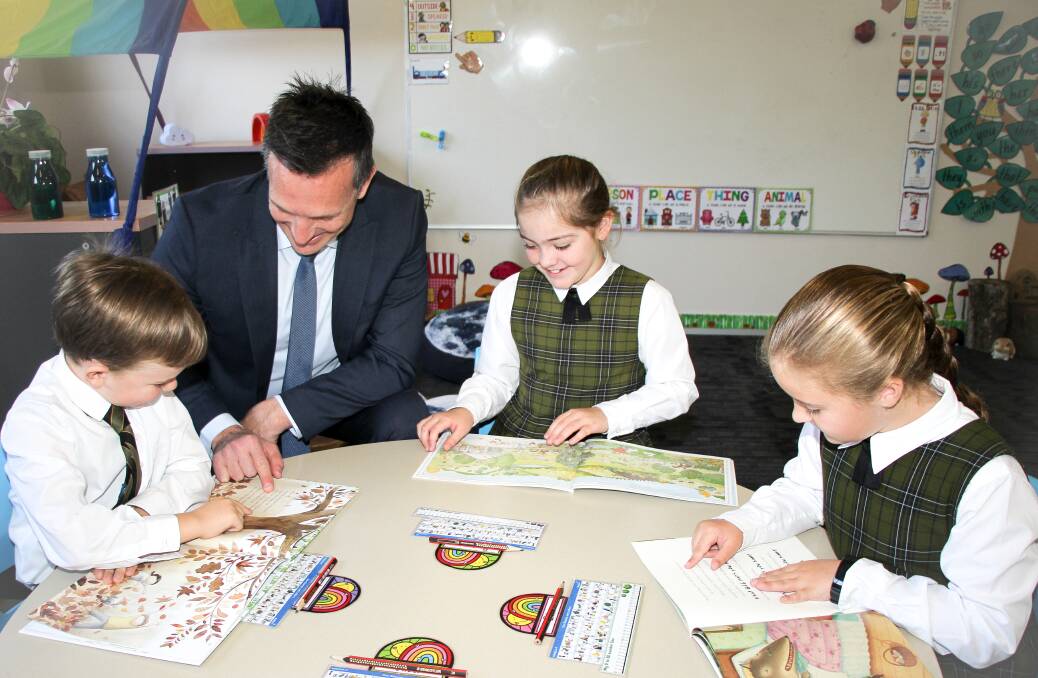 Principal Darren Cox with students at St Philips Christian College Junior School.