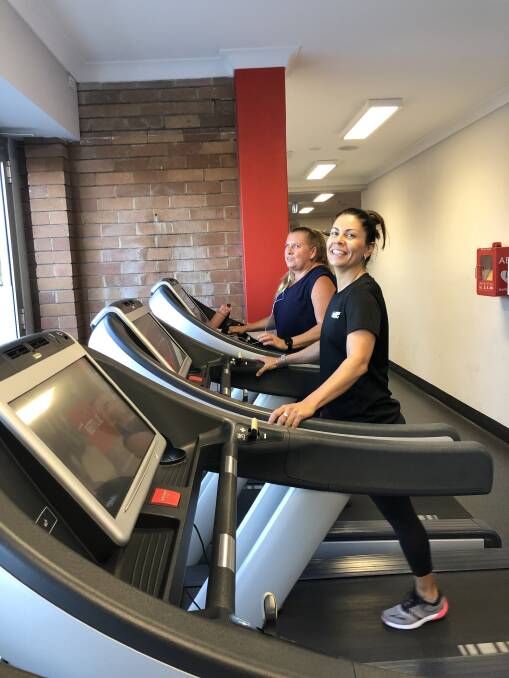 Making strides: Teressa and Silvia at Snap Fitness Cessnock clocking up the kilometres for The House with no Steps.