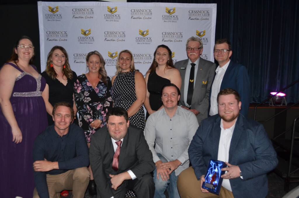 Winners are grinners: Celebrating their success the 2019 winning businesses at the 2019 Customer Service Awards Gala dinner on stage.