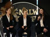 ALL SMILES: Newcastle Knights players Tamika Upton, Hannah Southwell and Millie Boyle on stage at the club's NRLW season launch on Tuesday. Picture: Simone De Peak