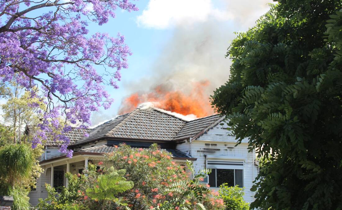 HOUSE FIRE: Flames spread from one house to an adjoining property on King Street. 