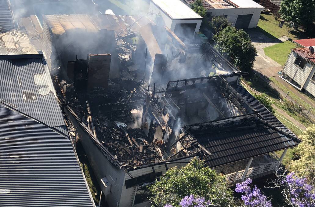 TOTALLY DESTROYED:  A small residential home's roof collapsed after it was engulfed in flames on Monday afternoon. Picture: Courtesy of Fire and Rescue NSW.