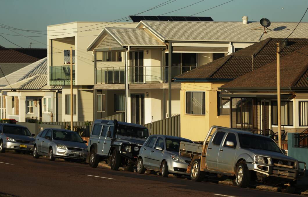 New, large homes are gradually replacing the older cottages along Stockton's beachfront. Picture: Simone De Peak