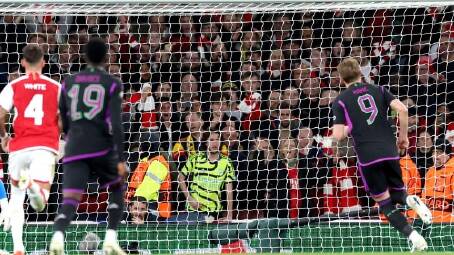 Harry Kane (9) scores for Bayern Munich against Arsenal in the first leg of their European tie. (EPA PHOTO)
