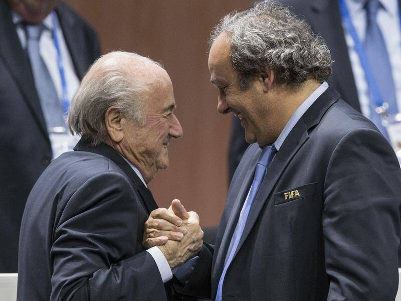 Sepp Blatter (l) and Michael Platini, former FIFA comrades, are charged with defrauding the body.