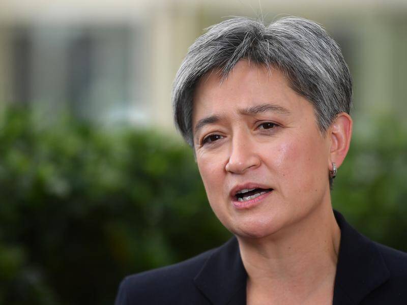 Labor's Penny Wong is raising questions about Australia's powers under the AUKUS submarine deal.