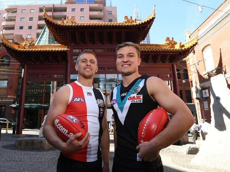 St Kilda and Port Adelaide will play a home and away game in China for three years from 2019.