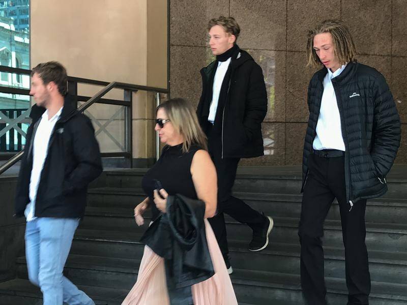 Floyd Hennessy's supporters leave a Melbourne court after he was refused bail on driving charges.