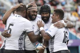 Fiji's Api Ratuniyarawa (centre left, headband) after scoring a try during the 2019 Rugby World Cup. (AP PHOTO)
